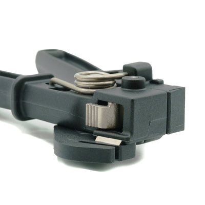 Close-up of a black Smart Band Flex Tool 2000 type, showing its silver tensioning mechanism and spring.